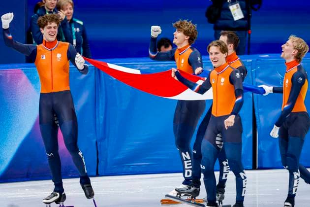 winner team of the Netherlands, Jens van t Wout of the Netherlands and Teun Boer of the Netherlands and Itzhak de Laat of the Netherlands and Friso Emons of the Netherlands and Melle van t Wout of the Netherlands celebrating and holding flag after Men s 5000m Relay Finals, Milano Cortina 2026 Winter Olympics: Day 14, Short Track Speed skating, Eisschnelllauf - Milano Cortina 2026 Winter Olympics: Day 14, Milano Speed Skating Stadium, February 20, 2026, Milan, Italy.