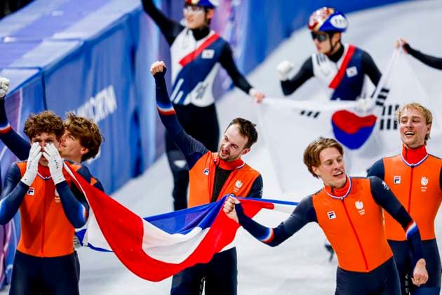 winner team of the Netherlands, Jens van t Wout of the Netherlands and Teun Boer of the Netherlands and Itzhak de Laat of the Netherlands and Friso Emons of the Netherlands and Melle van t Wout of the Netherlands celebrating and holding flag after Men s 5000m Relay Finals, Milano Cortina 2026 Winter Olympics: Day 14, Short Track Speed skating, Eisschnelllauf - Milano Cortina 2026 Winter Olympics: Day 14, Milano Speed Skating Stadium, February 20, 2026, Milan, Italy.