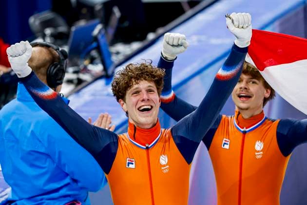 winner team of the Netherlands, Teun Boer of the Netherlands and Melle van t Wout of the Netherlands celebrating and holding flag after Men s 5000m Relay Finals, Milano Cortina 2026 Winter Olympics: Day 14, Short Track Speed skating, Eisschnelllauf - Milano Cortina 2026 Winter Olympics: Day 14, Milano Speed Skating Stadium, February 20, 2026, Milan, Italy.