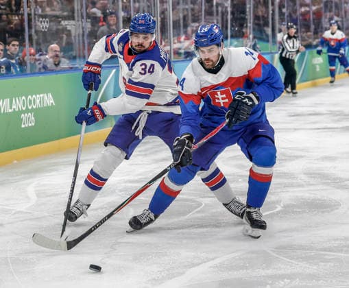 United States Auston Matthews (34) and Slovakia s Peter Ceresnak (14) go for the puck in the second period of the Men s Hockey Play-off Semifinal game between Slovakia and the USA at the Milano Santagiulia Ice hockey, Eishockey Arena in Milan, Italy, on Friday, February 20, 2026.  OLY20260220322 AARONxJOSEFCZYK
