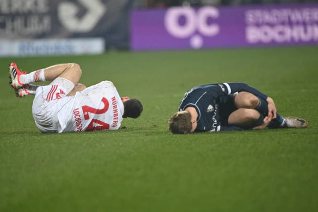 Luka LOCHOSHVILI N and Oliver OLSEN BO lie on the pitch, injured, injury, Football 2 Bundesliga, 23 Matchday, matchday 23, VfL Bochum BO 1 FC Nuernberg 1 1 on 20 02 2026, Vonovia Ruhrstadion Bochum Germany DFL regulations prohibit any use of photographs as image sequences and or quasi video ÃÂ