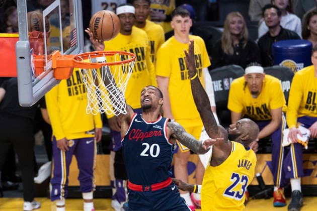 February 20, 2026, Los Angeles, California, USA: Los Angeles Clippers John Collins (20) goes past Los Angeles LakersÃ¢â‚¬â ¢ LeBron James (23) to the basket during an NBA, Basketball Herren, USA basketball game at Crypto.com Arena on Friday, Feb. 20, 2026 in Los Angeles. Los Angeles USA - ZUMAc68_ 20260220_zaf_c68_009 Copyright: xRingoxChiux