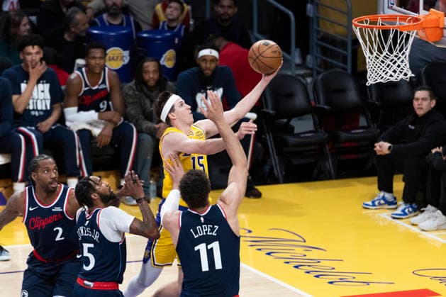 February 20, 2026, Los Angeles, California, USA: Los Angeles LakersÃ¢â‚¬â ¢ Austin Reaves (15) goes to the basket against Los Angeles Clippers Brook Lopez (11) during an NBA, Basketball Herren, USA basketball game at Crypto.com Arena on Friday, Feb. 20, 2026 in Los Angeles. Los Angeles USA - ZUMAc68_ 20260220_zaf_c68_004 Copyright: xRingoxChiux