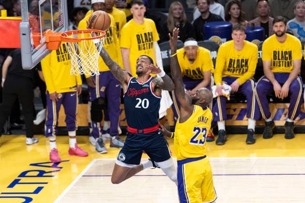 February 20, 2026, Los Angeles, California, USA: Los Angeles Clippers John Collins (20) goes past Los Angeles LakersÃ¢â‚¬â ¢ LeBron James (23) to the basket during an NBA, Basketball Herren, USA basketball game at Crypto.com Arena on Friday, Feb. 20, 2026 in Los Angeles. Los Angeles USA - ZUMAc68_ 20260220_zaf_c68_005 Copyright: xRingoxChiux