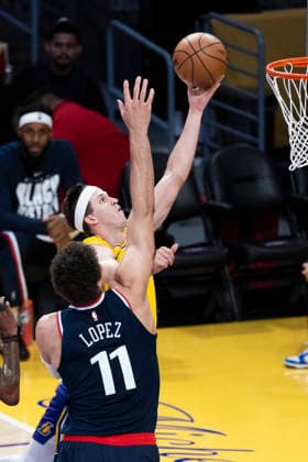 February 20, 2026, Los Angeles, California, USA: Los Angeles LakersÃ¢â‚¬â ¢ Austin Reaves (15) goes to the basket against Los Angeles Clippers Brook Lopez (11) during an NBA, Basketball Herren, USA basketball game at Crypto.com Arena on Friday, Feb. 20, 2026 in Los Angeles. Los Angeles USA - ZUMAc68_ 20260220_zaf_c68_008 Copyright: xRingoxChiux