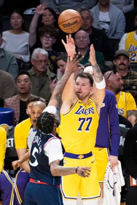 February 20, 2026, Los Angeles, California, USA: Los Angeles LakersÃ¢â‚¬â ¢ Luka DonÄÂiÄ¡ (77) shoots against Los Angeles Clippers Derrick Jones Jr. (5) during an NBA, Basketball Herren, USA basketball game at Crypto.com Arena on Friday, Feb. 20, 2026 in Los Angeles. Los Angeles USA - ZUMAc68_ 20260220_zaf_c68_037 Copyright: xRingoxChiux