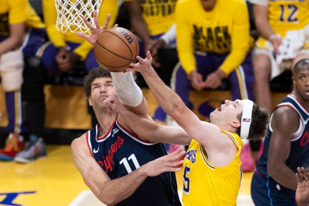 February 20, 2026, Los Angeles, California, USA: Los Angeles Clippers Brook Lopez (11) blocks a shot by Los Angeles LakersÃ¢â‚¬â ¢ Austin Reaves (15) during an NBA, Basketball Herren, USA basketball game at Crypto.com Arena on Friday, Feb. 20, 2026 in Los Angeles. Los Angeles USA - ZUMAc68_ 20260220_zaf_c68_056 Copyright: xRingoxChiux
