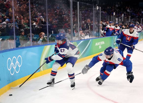 (260221) -- MILAN, Feb. 21, 2026 -- Quinn Hughes (L) of the United States and Oliver Okuliar (C) of Slovakia battle for the puck during the Ice hockey, Eishockey men s play-offs semifinal match between the United States and Slovakia at the Milan-Cortina 2026 Olympic Winter games, Winterspiele,Spiele, Summer games in Milan, Italy, Feb. 20, 2026. ) (MICO2026)ITALY-MILAN-OLYMPIC WINTER GAMES-ICE HOCKEY-MEN-PLAY-OFFS SEMIFINALS-USA VS SVK WangxKaiyan 