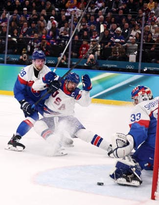 (260221) -- MILAN, Feb. 21, 2026 -- Auston Matthews (C) of the United States competes with Martin Gernat (L) of Slovakia during the Ice hockey, Eishockey men s play-offs semifinal match between the United States and Slovakia at the Milan-Cortina 2026 Olympic Winter games, Winterspiele,Spiele, Summer games in Milan, Italy, Feb. 20, 2026. ) (MICO2026)ITALY-MILAN-OLYMPIC WINTER GAMES-ICE HOCKEY-MEN-PLAY-OFFS SEMIFINALS-USA VS SVK WangxKaiyan 