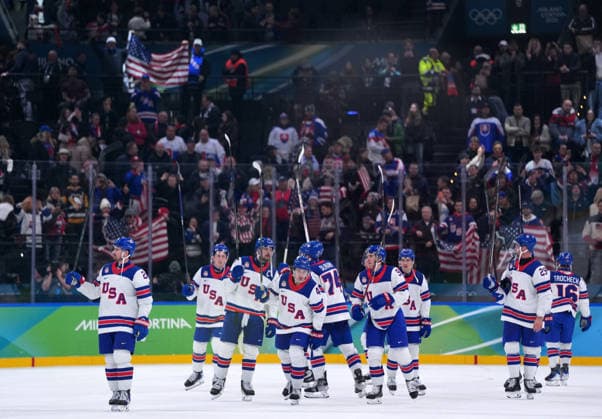 (260221) -- MILAN, Feb. 21, 2026 -- Players of the United States celebrate victory after winning the Ice hockey, Eishockey men s play-offs semifinal match between the United States and Slovakia at the Milan-Cortina 2026 Olympic Winter games, Winterspiele,Spiele, Summer games in Milan, Italy, Feb. 20, 2026. ) (MICO2026)ITALY-MILAN-OLYMPIC WINTER GAMES-ICE HOCKEY-MEN-PLAY-OFFS SEMIFINALS-USA VS SVK TaoxXiyi 