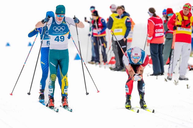 OLYMPICS - Winter Olympic Games, Olympische Spiele, Olympia, OS Milano Cortina 2026 TESERO,ITALY,21.FEB.26 - OLYMPICS, NORDIC SKIING, NORDIC COMBINED, CROSS COUNTRY - Winter Olympic Games Milano Cortina 2026, 50km, mass start, classic, men. Image shows Seve de Campo (AUS), Nail Bashmakov (KAZ) and Raimo Vigants (LAT).  GEPAxpictures xMatthiasxTrinkl