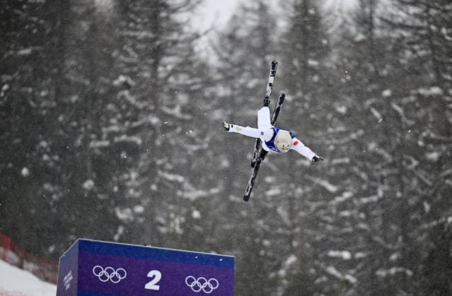 (260221) -- LIVIGNO, Feb. 21, 2026 -- Wang Xindi of China competes during the freestyle skiing mixed team aerials final 2 at the Milan-Cortina 2026 Olympic Winter games, Winterspiele,Spiele, Summer games in Livigno, Italy, Feb. 21, 2026. ) (MICO2026)ITALY-LIVIGNO-OLYMPIC WINTER GAMES-FREESTYLE SKIING-MIXED TEAM AERIALS-FINAL ZhangxHongxiang 