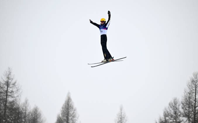 (260221) -- LIVIGNO, Feb. 21, 2026 -- Li Tianma of China competes during the freestyle skiing mixed team aerials final 2 at the Milan-Cortina 2026 Olympic Winter games, Winterspiele,Spiele, Summer games in Livigno, Italy, Feb. 21, 2026. ) (MICO2026)ITALY-LIVIGNO-OLYMPIC WINTER GAMES-FREESTYLE SKIING-MIXED TEAM AERIALS-FINAL ZhangxHongxiang 