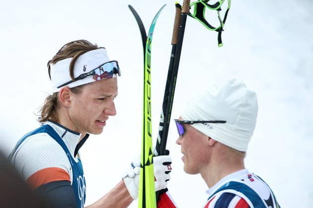 ITALY, TESERO - FEBRUARY 21, 2026: AIN athlete Savelii Korostelev (L) from Russia after competing in the men s nross-nountry skiing 50km mass start classic event during the 2026 Winter Olympic Games, Olympische Spiele, Olympia, OS at the Cross-Country and Biathlon Centre Fabio Canal. Mikhail Tereshchenko TASS  89033565