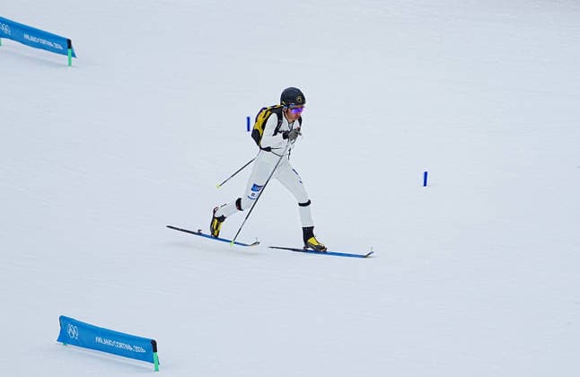 (260221) -- BORMIO, Feb. 21, 2026 -- Bu Luer of China competes during the ski mountaineering mixed relay event at the Milan-Cortina 2026 Olympic Winter games, Winterspiele,Spiele, Summer games in Bormio, Italy, Feb. 21, 2026. ) (MICO2026)ITALY-BORMIO-OLYMPIC WINTER GAMES-SKI MOUNTAINEERING-MIXED RELAY YanxLinyun 