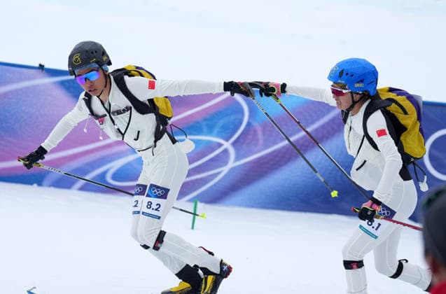 (260221) -- BORMIO, Feb. 21, 2026 -- Cidan Yuzhen (R) and her teammate Bu Luer of China compete during the ski mountaineering mixed relay event at the Milan-Cortina 2026 Olympic Winter games, Winterspiele,Spiele, Summer games in Bormio, Italy, Feb. 21, 2026. ) (MICO2026)ITALY-BORMIO-OLYMPIC WINTER GAMES-SKI MOUNTAINEERING-MIXED RELAY HuxHuhu 