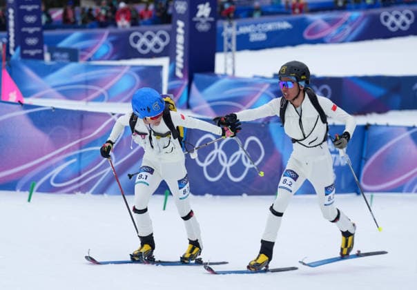 (260221) -- BORMIO, Feb. 21, 2026 -- Cidan Yuzhen (L) and her teammate Bu Luer of China compete during the ski mountaineering mixed relay event at the Milan-Cortina 2026 Olympic Winter games, Winterspiele,Spiele, Summer games in Bormio, Italy, Feb. 21, 2026. ) (MICO2026)ITALY-BORMIO-OLYMPIC WINTER GAMES-SKI MOUNTAINEERING-MIXED RELAY HuxHuhu 
