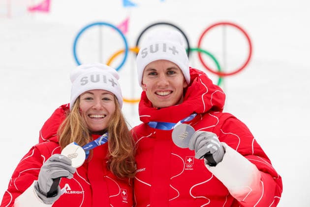 OLYMPICS - Winter Olympic Games, Olympische Spiele, Olympia, OS Milano Cortina 2026 BORMIO,ITALY,21.FEB.26 - OLYMPICS, SKI MOUNTAINEERING - Winter Olympic Games Milano Cortina 2026, Skicross, mixed relay, final, medal ceremony. Image shows the rejoicing of Jon Kistler and Marianne Fatton (SUI).  GEPAxpictures xHaraldxSteiner
