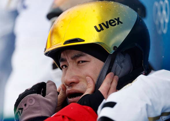 (260221) -- LIVIGNO, Feb. 21, 2026 -- Li Tianma of China reacts after freestyle skiing mixed team aerials final 2 at the Milan-Cortina 2026 Olympic Winter games, Winterspiele,Spiele, Summer games in Livigno, Italy, Feb. 21, 2026. ) (MICO2026)ITALY-LIVIGNO-OLYMPIC WINTER GAMES-FREESTYLE SKIING-MIXED TEAM AERIALS-FINAL WangxPeng 