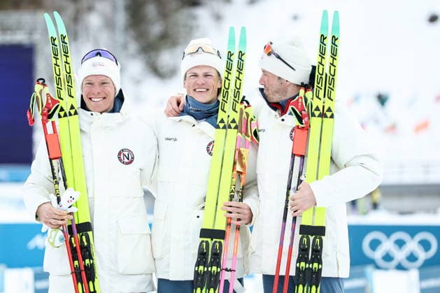 ITALY, TESERO - FEBRUARY 21, 2026: Silver medalist Martin Loewstroem Nyenget of Norway, gold medalist Johannes Hoesflot Klaebo of Norway and bronze medalist Emil Iversen (L-R) of Norway pose during a victory ceremony for the men s nross-nountry skiing 50km mass start classic event during the 2026 Winter Olympic Games, Olympische Spiele, Olympia, OS at the Cross-Country and Biathlon Centre Fabio Canal 2026 Winter Olympics: Cross-Country Skiing  - ZUMAt113 20260221_zaa_t113_295 Copyright: xMikhailxTereshchenkox