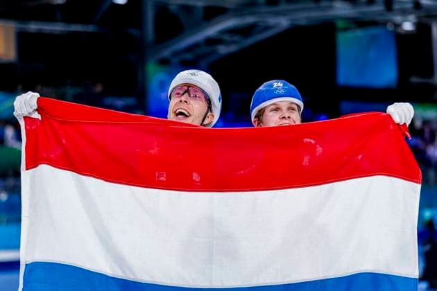 winner Jorrit Bergsma of the Netherlands and Stijn Van De Bunt of the Netherlands celebrating and holding flag after Men s Mass Start Final, Milano Cortina 2026 Winter Olympics: Day 15, Speed skating, Eisschnelllauf - Milano Cortina 2026 Winter Olympics: Day 15, Milano Speed Skating Stadium, February 21, 2026, Milan, Italy.