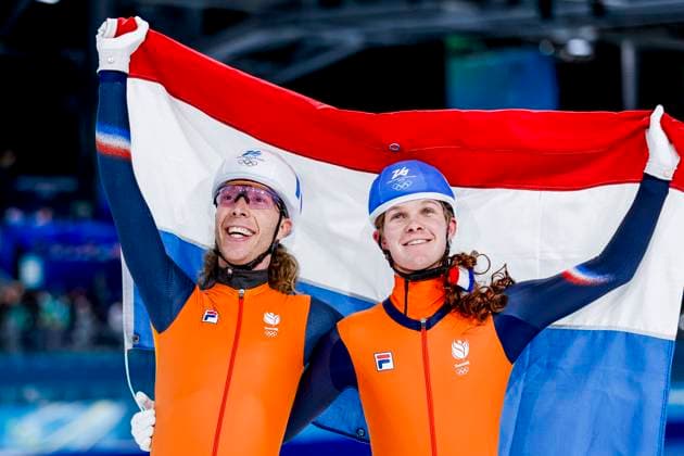 winner Jorrit Bergsma of the Netherlands and Stijn Van De Bunt of the Netherlands celebrating and holding flag after Men s Mass Start Final, Milano Cortina 2026 Winter Olympics: Day 15, Speed skating, Eisschnelllauf - Milano Cortina 2026 Winter Olympics: Day 15, Milano Speed Skating Stadium, February 21, 2026, Milan, Italy.