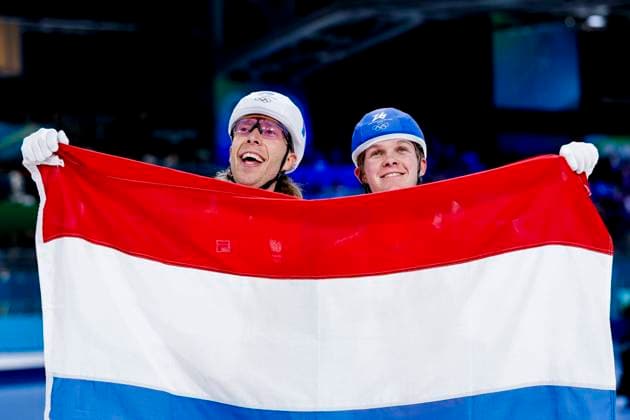 winner Jorrit Bergsma of the Netherlands and Stijn Van De Bunt of the Netherlands celebrating and holding flag after Men s Mass Start Final, Milano Cortina 2026 Winter Olympics: Day 15, Speed skating, Eisschnelllauf - Milano Cortina 2026 Winter Olympics: Day 15, Milano Speed Skating Stadium, February 21, 2026, Milan, Italy.