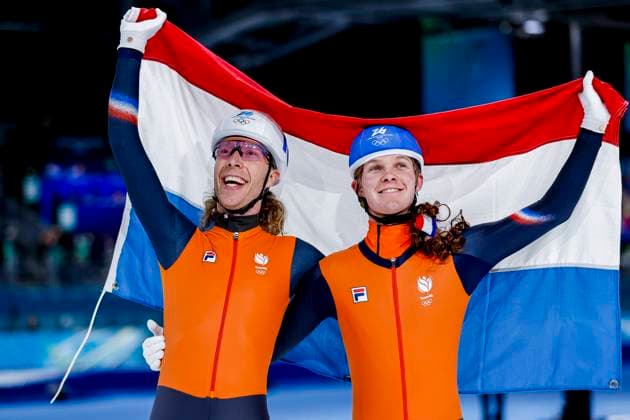 winner Jorrit Bergsma of the Netherlands and Stijn Van De Bunt of the Netherlands celebrating and holding flag after Men s Mass Start Final, Milano Cortina 2026 Winter Olympics: Day 15, Speed skating, Eisschnelllauf - Milano Cortina 2026 Winter Olympics: Day 15, Milano Speed Skating Stadium, February 21, 2026, Milan, Italy.