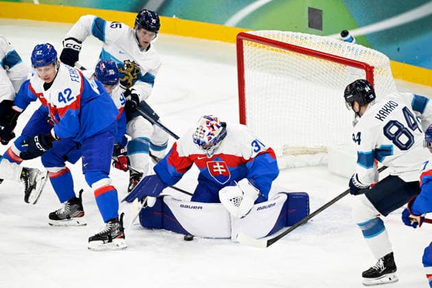 LKS 20260221 Martin Fehervary (left) and goalkeeper Samuel Hlavaj of Slovakia and Anton Lundell (2nd left) and Kaapo Kakko of Finland in action during the men s Ice hockey, Eishockey bronze medal match between Slovakia and Finland during the Milano Cortina Winter Olympics at the Milano Santa Giulia Ice Hockey Arena in Milan on February 21, 2026. - EMMI KORHONEN Milano Italy skDBc5yE0hI  Copyright: xEmmixKorhonenx skDBc5yE0hI