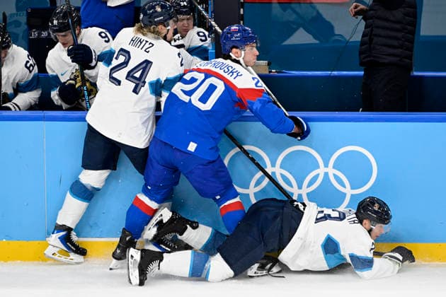 LKS 20260221 Roope Hintz and Olli Määttä of FInland and Juraj Slafkovsky of Slovakia in action during the men s Ice hockey, Eishockey bronze medal match between Slovakia and Finland during the Milano Cortina Winter Olympics at the Milano Santa Giulia Ice Hockey Arena in Milan on February 21, 2026. - EMMI KORHONEN Milano Italy XWZbC9bcNOk  Copyright: xEmmixKorhonenx XWZbC9bcNOk