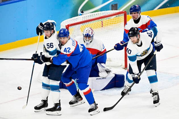 LKS 20260221 Erik Haula (left) and Joel Armia of FInland and Martin Fehervary (2nd left), goalkeeper Samuel Hlavaj and Simon Nemec of Slovakia in action during the men s Ice hockey, Eishockey bronze medal match between Slovakia and Finland during the Milano Cortina Winter Olympics at the Milano Santa Giulia Ice Hockey Arena in Milan on February 21, 2026. - EMMI KORHONEN Milano Italy xzaKyOHeD0M  Copyright: xEmmixKorhonenx xzaKyOHeD0M