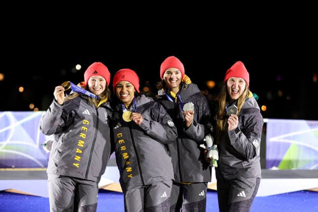 OLYMPICS - Winter Olympic Games, Olympische Spiele, Olympia, OS Milano Cortina 2026 CORTINA D AMPEZZO,ITALY,21.FEB.26 - OLYMPICS, BOBSLEIGH - Winter Olympic Games Milano Cortina 2026, 2-woman, heat 3 and 4, medal ceremony. Image shows the rejoicing of the rejoicing of Lisa Buckwitz, Neele Schuten, Levi Deborah, Laura Nolte (GER). Keywords: medal.  GEPAxpictures xMaticxKlansek