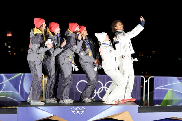 OLYMPICS - Winter Olympic Games, Olympische Spiele, Olympia, OS Milano Cortina 2026 CORTINA D AMPEZZO,ITALY,21.FEB.26 - OLYMPICS, BOBSLEIGH - Winter Olympic Games Milano Cortina 2026, 2-woman, heat 3 and 4, medal ceremony. Image shows the rejoicing of the rejoicing of Lisa Buckwitz, Neele Schuten, Levi Deborah, Laura Nolte (GER), Kaillie Armbruster Humphries and Jasmine Jones (USA). Keywords: medal.  GEPAxpictures xMaticxKlansek