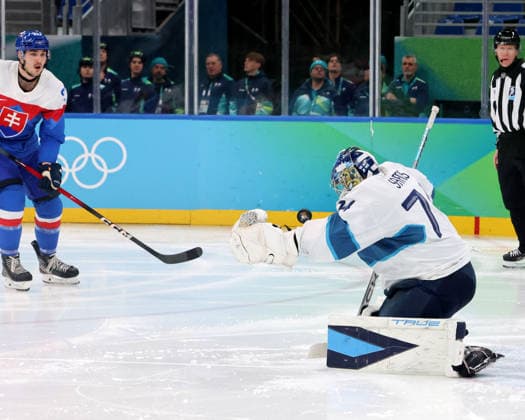 February 21, 2026, Milan, Lombardy, Italy: Juuse Saros (74) of Team Finland blocks shot by Team Slovakia in the men s Ice hockey, Eishockey bronze medal game during the Milano Cortina 2026 Olympic Winter games, Winterspiele,Spiele, Summer games at Milano Santagiulia Ice Hockey Arena. Milan Italy - ZUMAm117 20260221_oly_m117_019 Copyright: xDavidxMcIntyrex