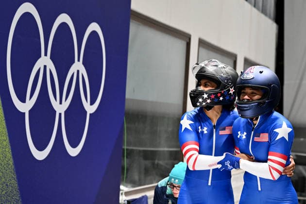 Cortina d Ampezzo, Italy, February 21th 2026. Kaysha Love and Azaria Hill of United States of America celebrate in finish after the Bobsleight 2-woman Heat 3 and 4 race of the Olympic Winter games, Winterspiele,Spiele, Summer games 2026 in Cortina d Ampezzo, Italy. (Photo by Igor Kupljenik Sports Press Photo)  Copyright: xIgorxKupljenikx xSPPx Sportspressphoto_SPR95793