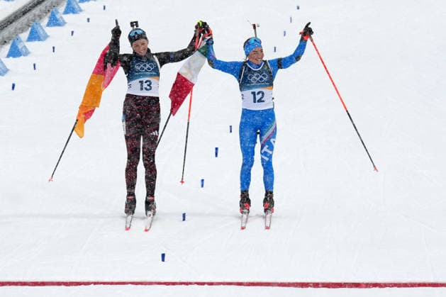 Milano Cortina 2026, Antholz, Italy, 21.02, 2026, MiCo2026, MiCo, 2026, Olympics, Olympic, Winter Olympic, Olympic Winter games, Winterspiele,Spiele, Summer games Antholz, biathlon, Anterselva Biathlon Arena, Anterselva Franziska Preuss from Germany and Dorothea Wierer from Italy celebrate after their 12.5 kilometers Women™s Mass start race of Milano Cortina 2026 Olympic Winter Games in Anterselva Biathlon Arena, Italy, 21.02.2026. Photo: Roman Koksarov (RKF) Antholz Italy Copyright: xRomanxKoksarovx biathlon_MiCo20260221rk721.JPG
