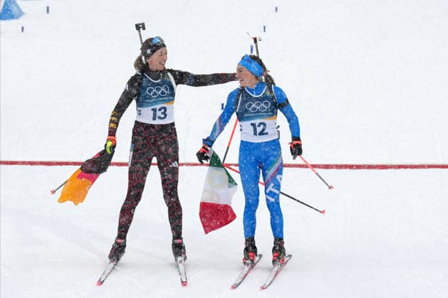 Milano Cortina 2026, Antholz, Italy, 21.02, 2026, MiCo2026, MiCo, 2026, Olympics, Olympic, Winter Olympic, Olympic Winter games, Winterspiele,Spiele, Summer games Antholz, biathlon, Anterselva Biathlon Arena, Anterselva Franziska Preuss from Germany and Dorothea Wierer from Italy celebrate after their 12.5 kilometers Women™s Mass start race of Milano Cortina 2026 Olympic Winter Games in Anterselva Biathlon Arena, Italy, 21.02.2026. Photo: Roman Koksarov (RKF) Antholz Italy Copyright: xRomanxKoksarovx biathlon_MiCo20260221rk736.JPG