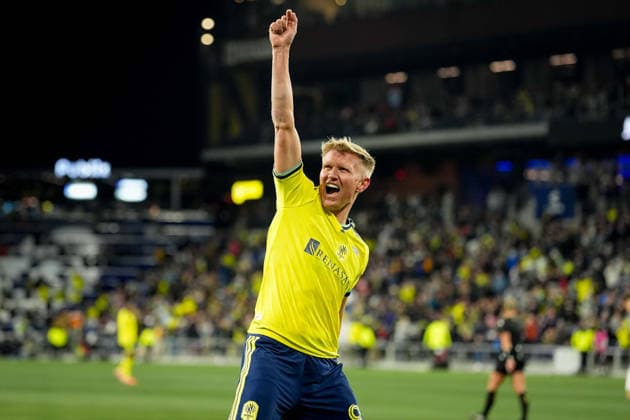 February 21, 2026, Nashville, Tennessee, USA: Nashville SC forward Sam Surridge (9) celebrates his goal against the New England Revolution during the first half at Geodis Park. MLS, Fussball Herren, USA Soccer 2026: New England Revolution At Nashville SC  - ZUMAh237 20260221_zsp_h237_055 Copyright: xCamdenxHallx