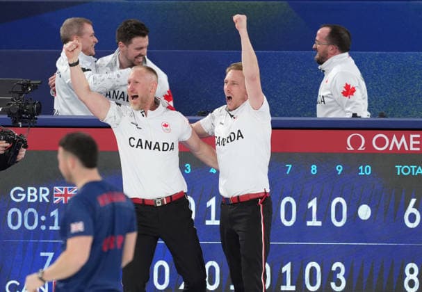 260221 -- CORTINA D AMPEZZO, Feb. 21, 2026 -- Players of Canada celebrate after the curling men s gold medal game between Canada and Britain at the 2026 Milan-Cortina Winter Olympics in Cortina, Italy, Feb. 21, 2026. MICO2026ITALY-CORTINA D AMPEZZO-OLYMPIC Winter games, Winterspiele,Spiele, Summer games CURLING-MEN-GOLD MEDAL GAME-CAN VS GBR LixGang  (MICO2026)ITALY-CORTINA D AMPEZZO-OLYMPIC WINTER GAMES-CURLING-MEN-GOLD MEDAL GAME-CAN VS GBR IMAGO LixGang  imago images 0848250670