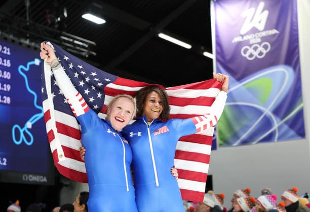(260222) -- CORTINA D AMPEZZO, Feb. 22, 2026 -- Kaillie Armbruster Humphries (L) Jasmine Jones of the United States celebrate after the Bobsleigh 2-woman heat 4 at the 2026 Milan-Cortina Winter Olympics in Cortina, Italy, Feb. 21, 2026. ) (MICO2026)ITALY-CORTINA D AMPEZZO-OLYMPIC Winter games, Winterspiele,Spiele, Summer games BOBSLEIGH-2-WOMAN DingxXu 