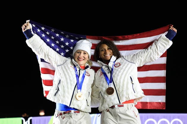 (260222) -- CORTINA D AMPEZZO, Feb. 22, 2026 -- Bronze medalists Kaillie Armbruster Humphries (L) Jasmine Jones of the United States celebrate during the awarding ceremony for the Bobsleigh 2-woman at the 2026 Milan-Cortina Winter Olympics in Cortina, Italy, Feb. 21, 2026. ) (MICO2026)ITALY-CORTINA D AMPEZZO-OLYMPIC Winter games, Winterspiele,Spiele, Summer games BOBSLEIGH-2-WOMAN DingxXu 