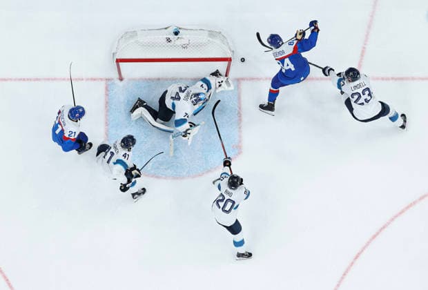(260222) -- MILAN, Feb. 22, 2026 -- Pavol Regenda (top, 2nd R) of Slovakia shoots during the Ice hockey, Eishockey men s bronze medal game between Slovakia and Finland at the Milan-Cortina 2026 Olympic Winter games, Winterspiele,Spiele, Summer games in Milan, Italy, Feb. 21, 2026. ) (MICO2026)ITALY-MILAN-OLYMPIC WINTER GAMES-ICE HOCKEY-MEN-BRONZE MEDAL GAME-SVK VS FIN ZhangxHaofu 