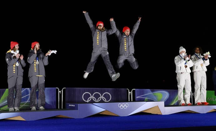 Milan Cortina Olympics: Bobsleigh Germany s Laura Nolte (C, L) and Deborah Levi (C, R) jump onto the podium after winning gold in the two-woman bobsleigh at the Milan Cortina Olympics on Feb. 21, 2026, at Cortina Sliding Centre in Cortina d Ampezzo, Italy.  A14AA0005313580P