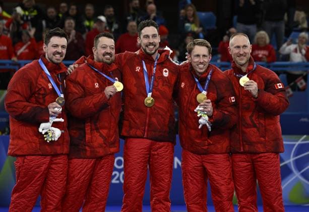 Milan Cortina Olympics: Curling Members of the Canadian men s curling team pose after winning gold at the Milan Cortina Olympics on Feb. 21, 2026, at Cortina Curling Olympic Stadium in Cortina d Ampezzo, Italy.  A14AA0005313594P