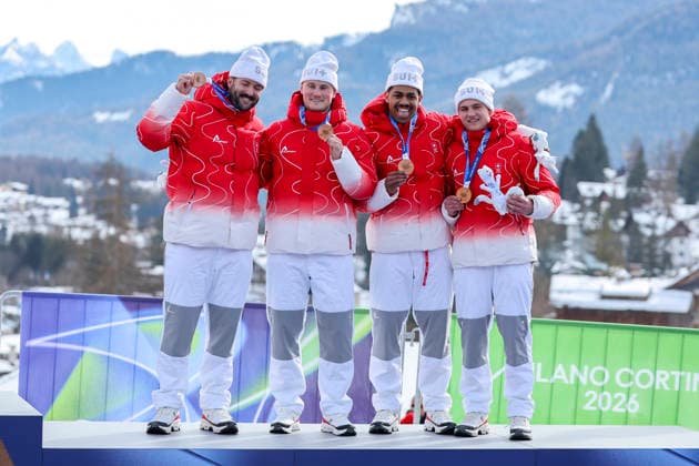 OLYMPICS - Winter Olympic Games, Olympische Spiele, Olympia, OS Milano Cortina 2026 CORTINA D AMPEZZO,ITALY,22.FEB.26 - OLYMPICS, BOBSLEIGH - Winter Olympic Games Milano Cortina 2026, 4-man, heat 3 and 4. Image shows the rejoicing of Michael Vogt, Andreas Haas, Amadou David Ndiaye and Mario Aeberhard (SUI).  GEPAxpictures xMaticxKlansek