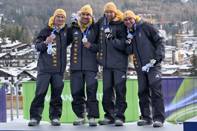Cortina d Ampezzo, Italy, February 22th 2026. Second place and Silver medal Francesco Friedrich, Matthias Sommer, Alexander Schuller, Felix Straub of Germany celebrate in podium after the Bobsleight 4-man Heat 4 race of the Olympic Winter games, Winterspiele,Spiele, Summer games 2026 in Cortina d Ampezzo, Italy. (Photo by Igor Kupljenik Sports Press Photo)  Copyright: xIgorxKupljenikx xSPPx Sportspressphoto_SPR96165