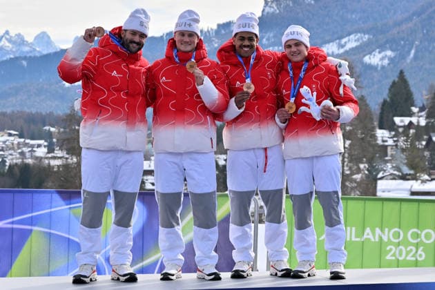 Cortina d Ampezzo, Italy, February 22th 2026. Third place and Bronze medal Michael Vogt, Andreas Haas, Amadou David Ndiaye, Aeberhard of Switzwerland celebrate in podium after the Bobsleight 4-man Heat 4 race of the Olympic Winter games, Winterspiele,Spiele, Summer games 2026 in Cortina d Ampezzo, Italy. (Photo by Igor Kupljenik Sports Press Photo)  Copyright: xIgorxKupljenikx xSPPx Sportspressphoto_SPR96166