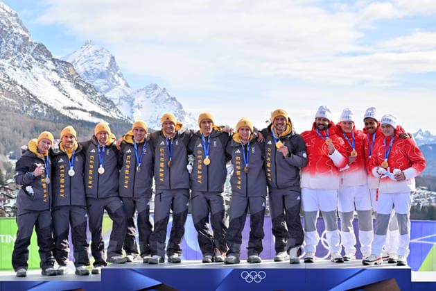 Cortina d Ampezzo, Italy, February 22th 2026. First place and Gold medal Johannes Lochner, Thorsten Margis, Jorn Wenzel, Georg Fleischhauer of Germany, Second place and Silver medal Francesco Friedrich, Matthias Sommer, Alexander Schuller, Felix Straub of Germany and Third place and Bronze medal Michael Vogt, Andreas Haas, Amadou David Ndiaye, Aeberhard of Switzwerland celebrate in podium after the Bobsleight 4-man Heat 4 race of the Olympic Winter games, Winterspiele,Spiele, Summer games 2026 in Cortina d Ampezzo, Italy. (Photo by Igor Kupljenik Sports Press Photo)  Copyright: xIgorxKupljenikx xSPPx Sportspressphoto_SPR96168