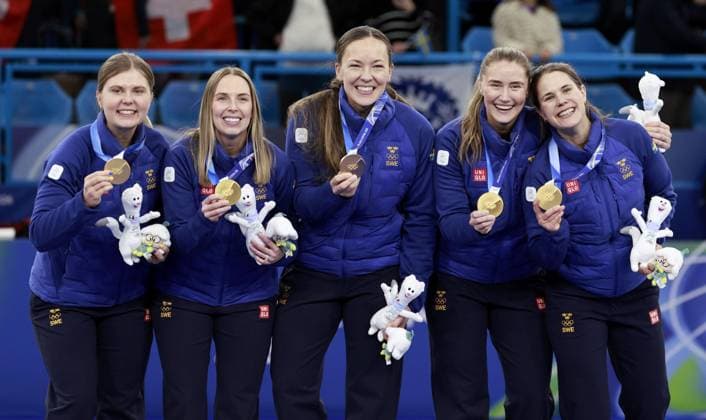 Milan Cortina Olympics: Curling Members of the Swedish women s curling team pose after winning gold at the Milan Cortina Olympics on Feb. 22, 2026, at Cortina Curling Olympic Stadium in Cortina d Ampezzo, Italy.  A14AA0005315143P