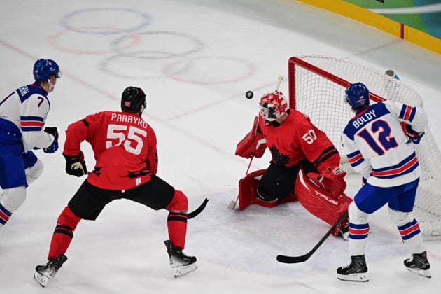 XXV Winter Olympic Games, Olympische Spiele, Olympia, OS in Milan, Italy, on February 22, 2026. Men s Ice hockey, Eishockey final, Canada vs USA. From left: Brady Tkachuk (USA), Colton Parayko (CAN), goalkeeper Jordan Binnington (CAN) and Matt Boldy (USA). (CTKxPhoto MichalxKamaryt) CTKPhotoP2026022203923  CTKPhotoP2026022203923